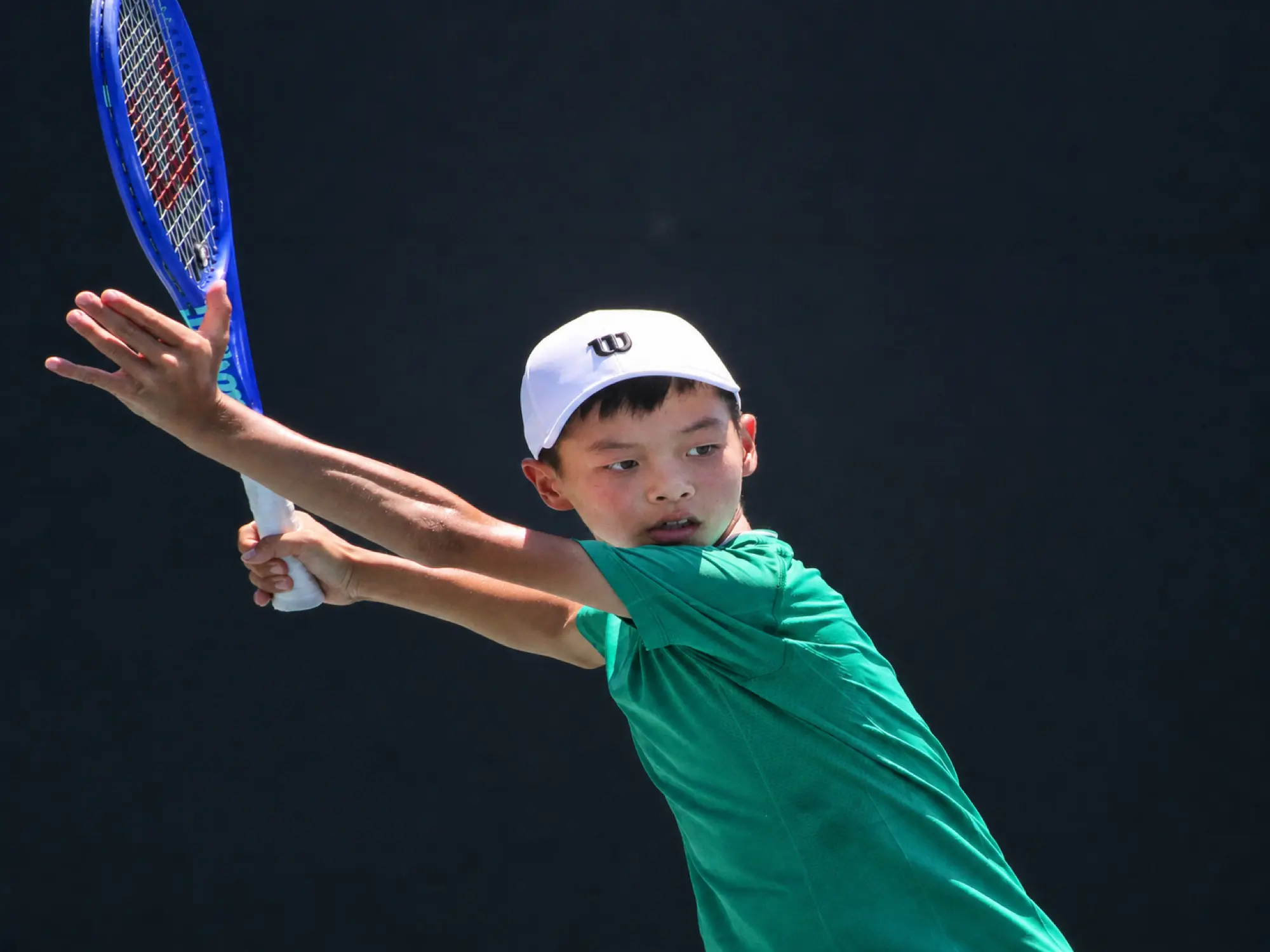 Junior tennis player hitting a forehand at Anaheim Tennis Center