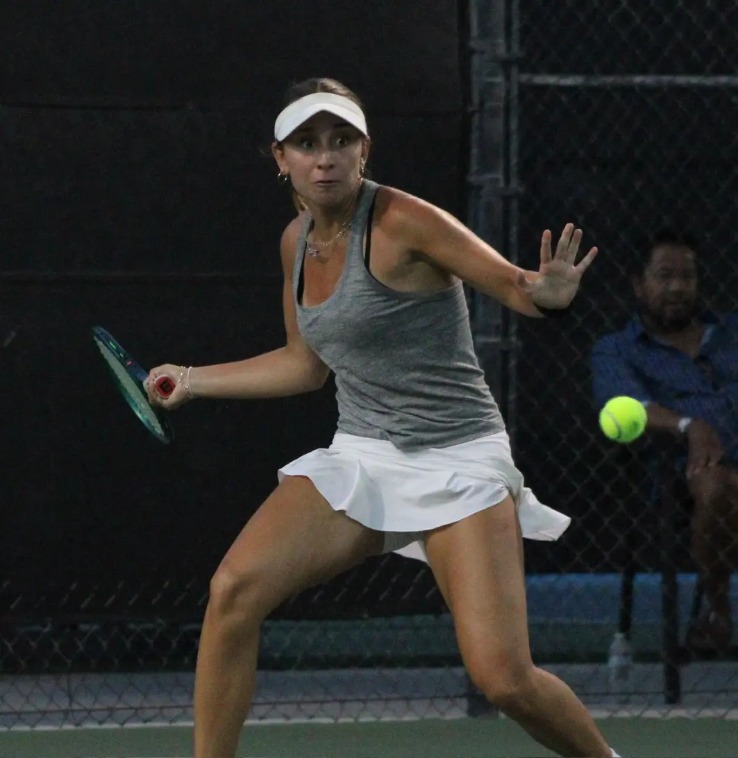 Junior girl hitting a tennis groundstroke
