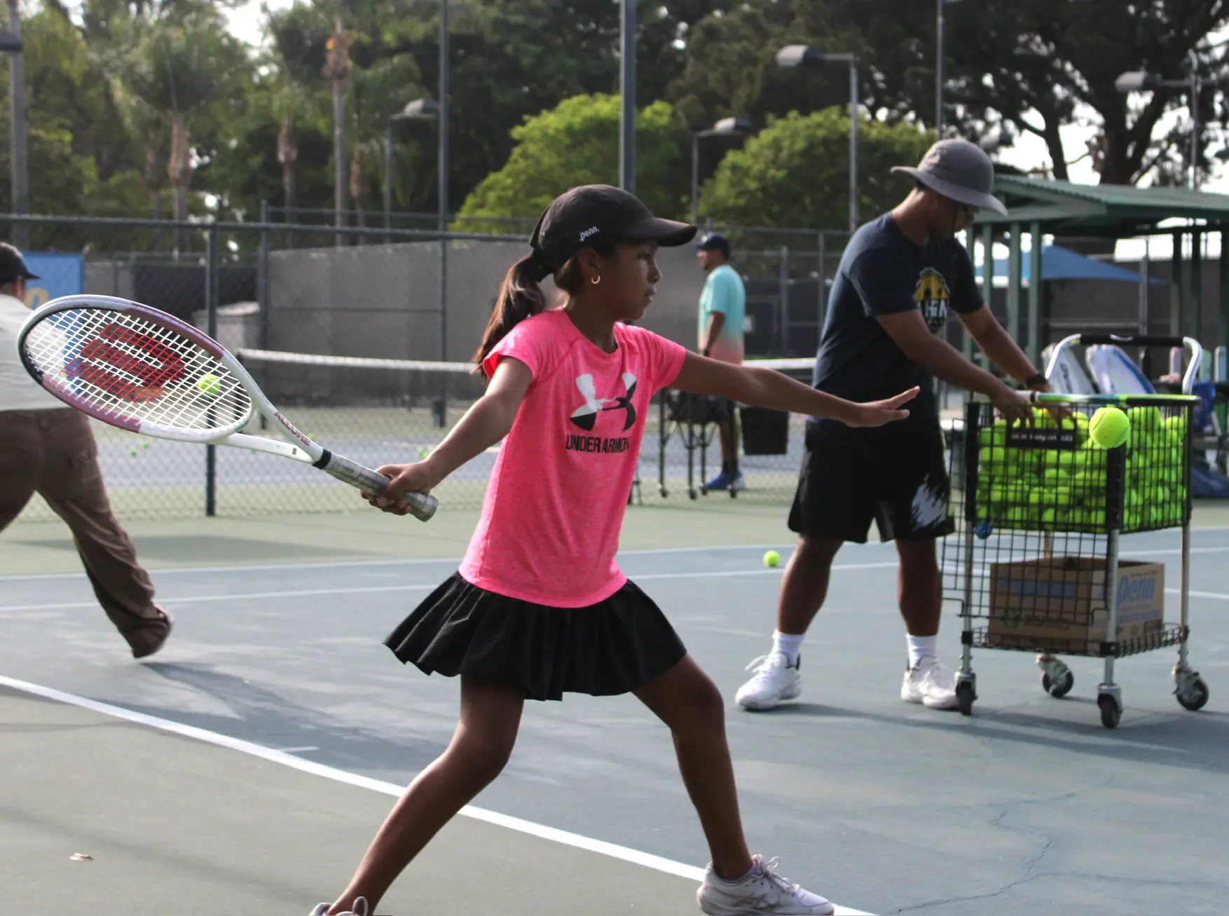 Junior tennis player practicing at Anaheim Tennis and Pickleball Center