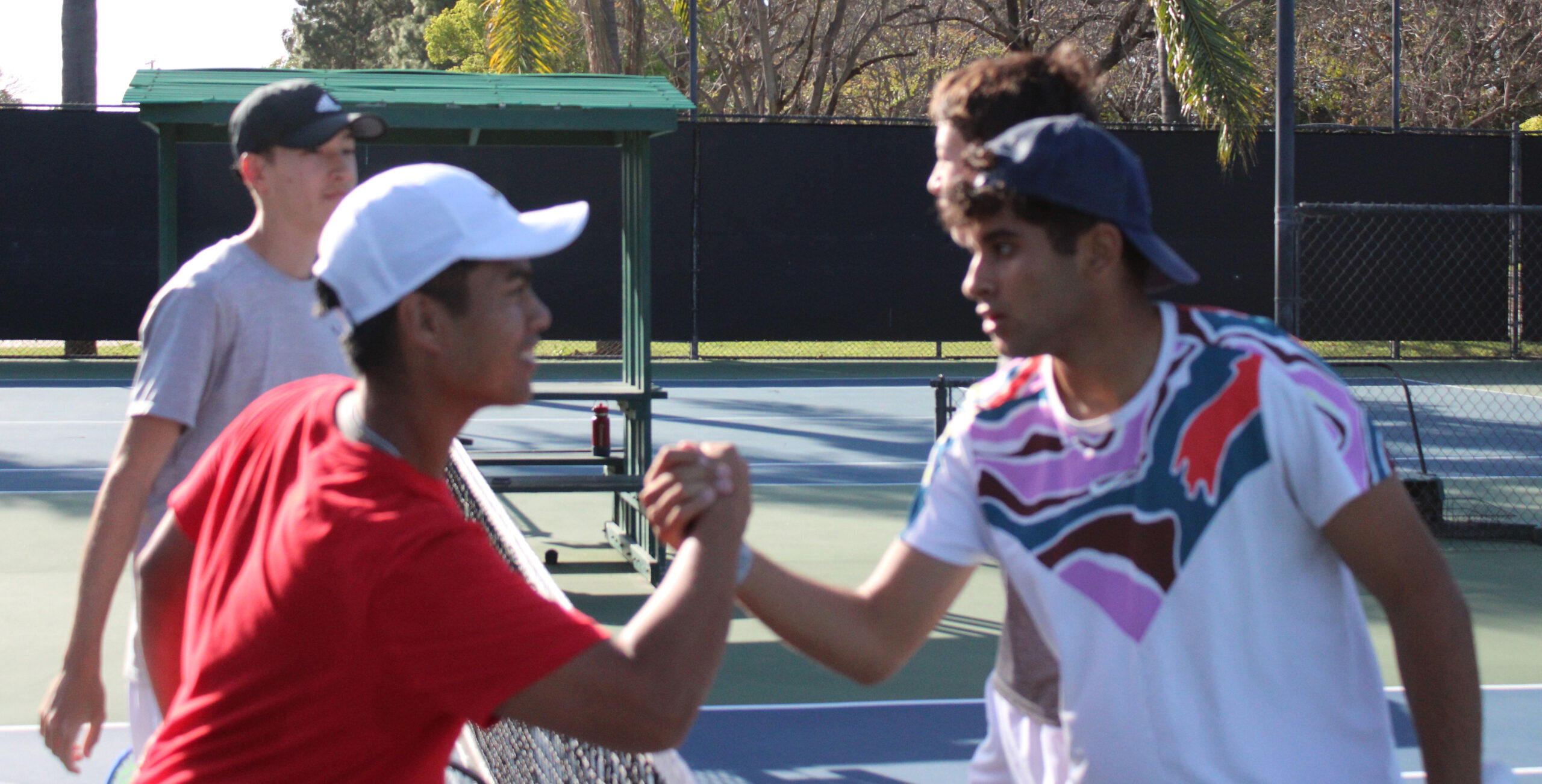 Tennis boys intenity at net copy