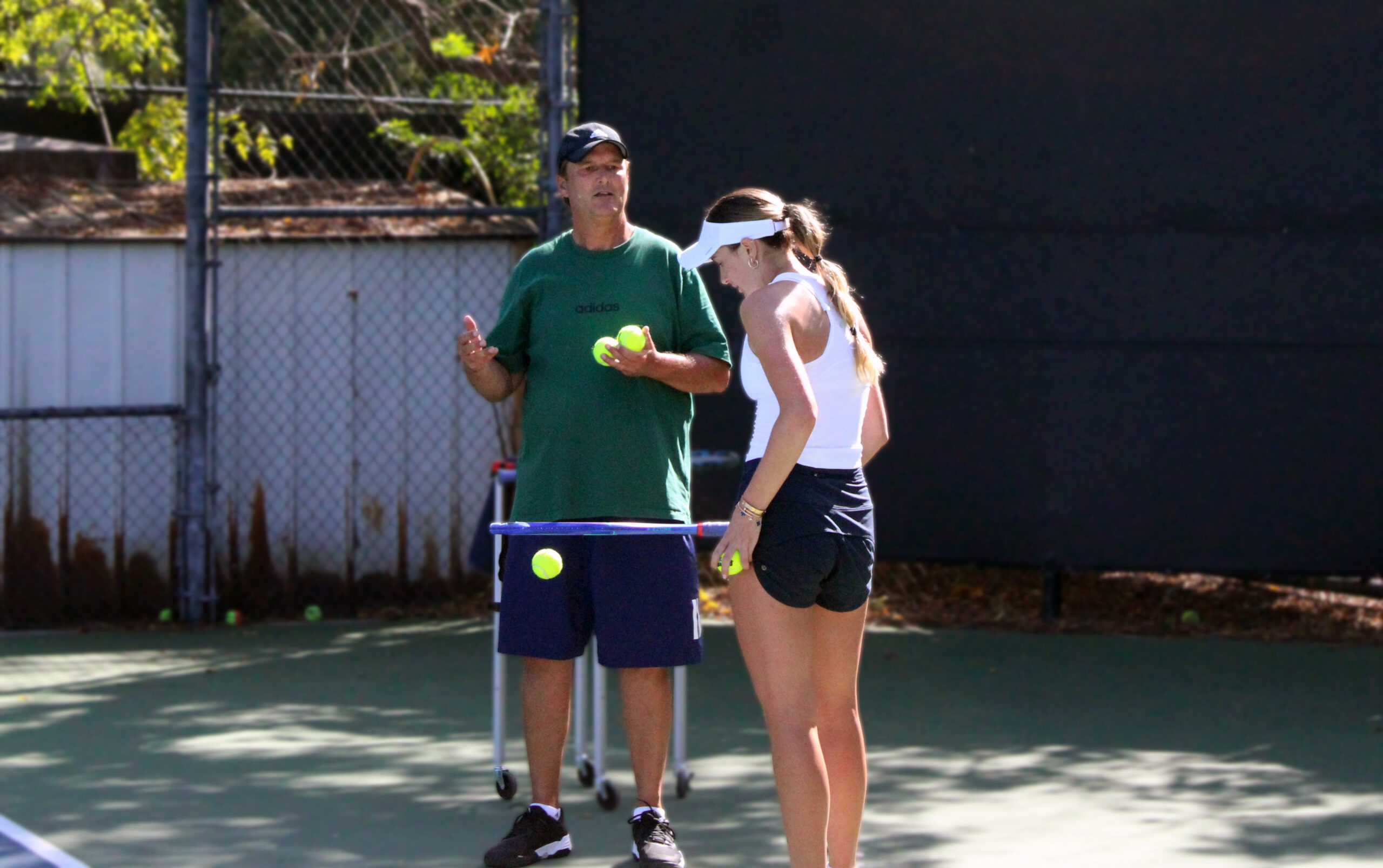 Adam coaching tennis page