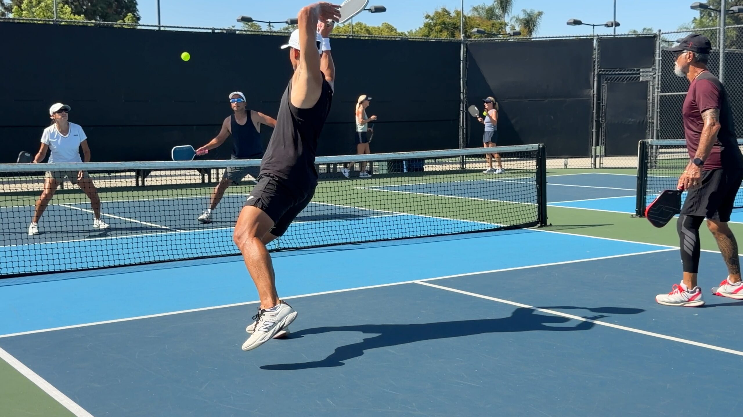 Athletic pickleball action at Anaheim Tennis & Pickleball Center