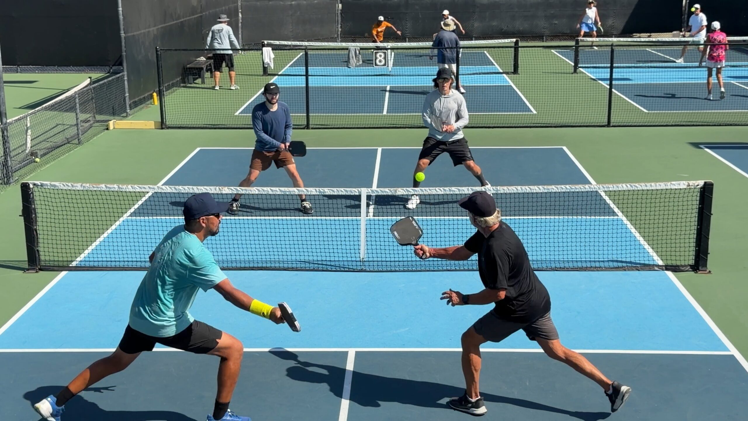 Pickleball doubles action on the courts at Anaheim Tennis and Pickleball Center